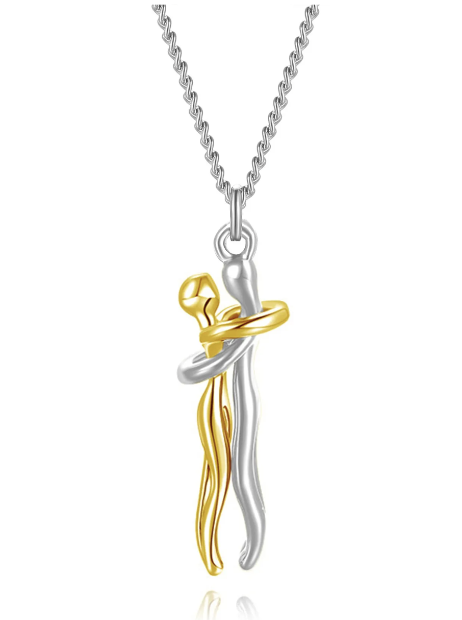 Close-up of the two embracing pendant pieces